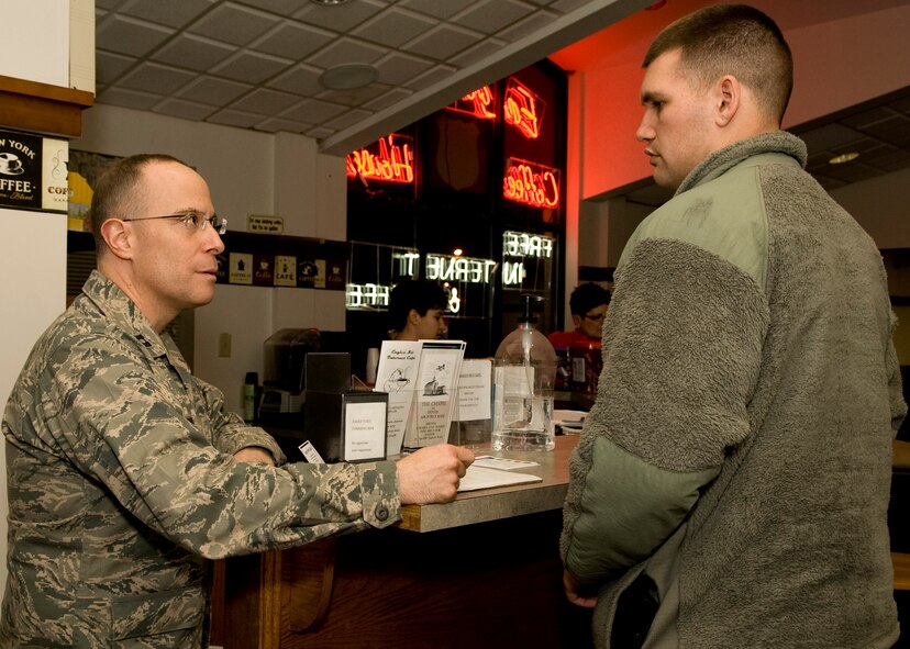 Chaplain (Capt.) Louis Mattina, 436th Airlift Wing chaplain, converses with Airman Kyle Artz, 436th Aircraft Maintenance Squadron crew chief, Feb. 26, 2014, at the Eagle’s Net Café Airman Ministry Center on Dover Air Force Base, Del. Mattina, a frequent visitor to the Café, enjoys the opportunity to interact with Team Dover’s Airmen.  (U.S. Air Force photo/Airman 1st Class Zachary Cacicia)