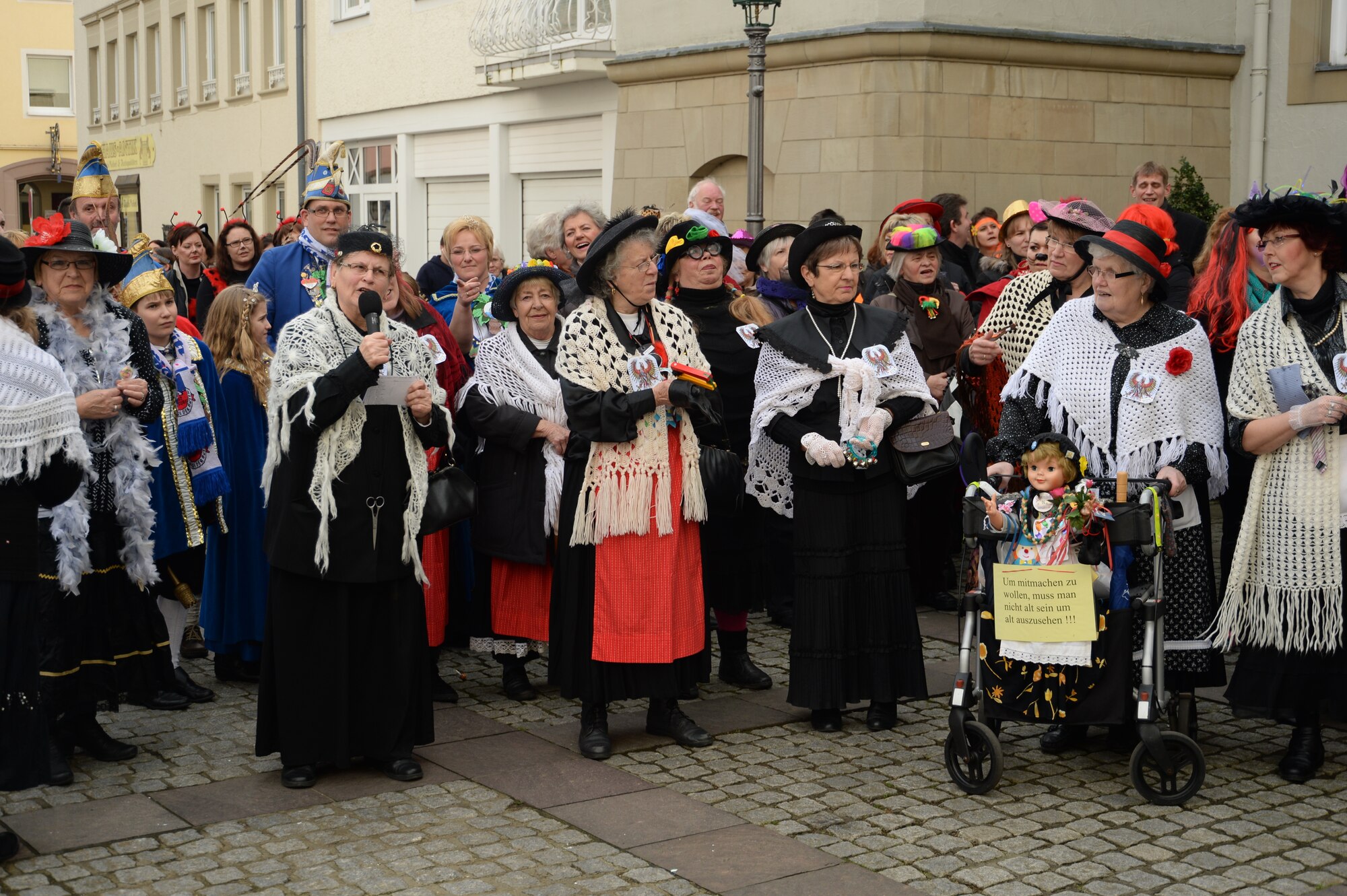 Female citizens of Bitburg, dressed in Fasching attire, present  their petition before city hall during a Fasching celebration in Bitburg, Germany, Feb. 27, 2014. As part of Fasching tradition, female citizens may cut off the tie of any male within reach. (U.S. Air Force photo by Staff Sgt. Joe W. McFadden/Released)