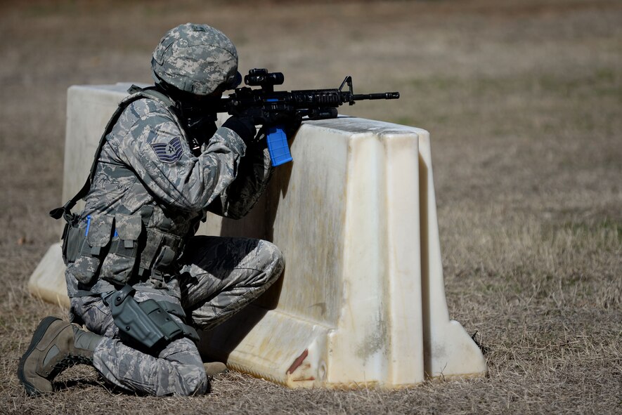U.S. Air Force Tech. Sgt. Michael Ambriz, 20th Security Forces Squadron flight chief, kneels to cover his advancing fire-team member during a squadron shoot, move, and communicate training at Shaw Air Force Base, S.C., Feb. 28, 2014. The training was held to sharpen the Airmen’s ability to perform on the battlefield and ensure they have the knowledge to be successful. (U.S. Air Force photo by Airman 1st Class Michael A. Cossaboom/Released) 