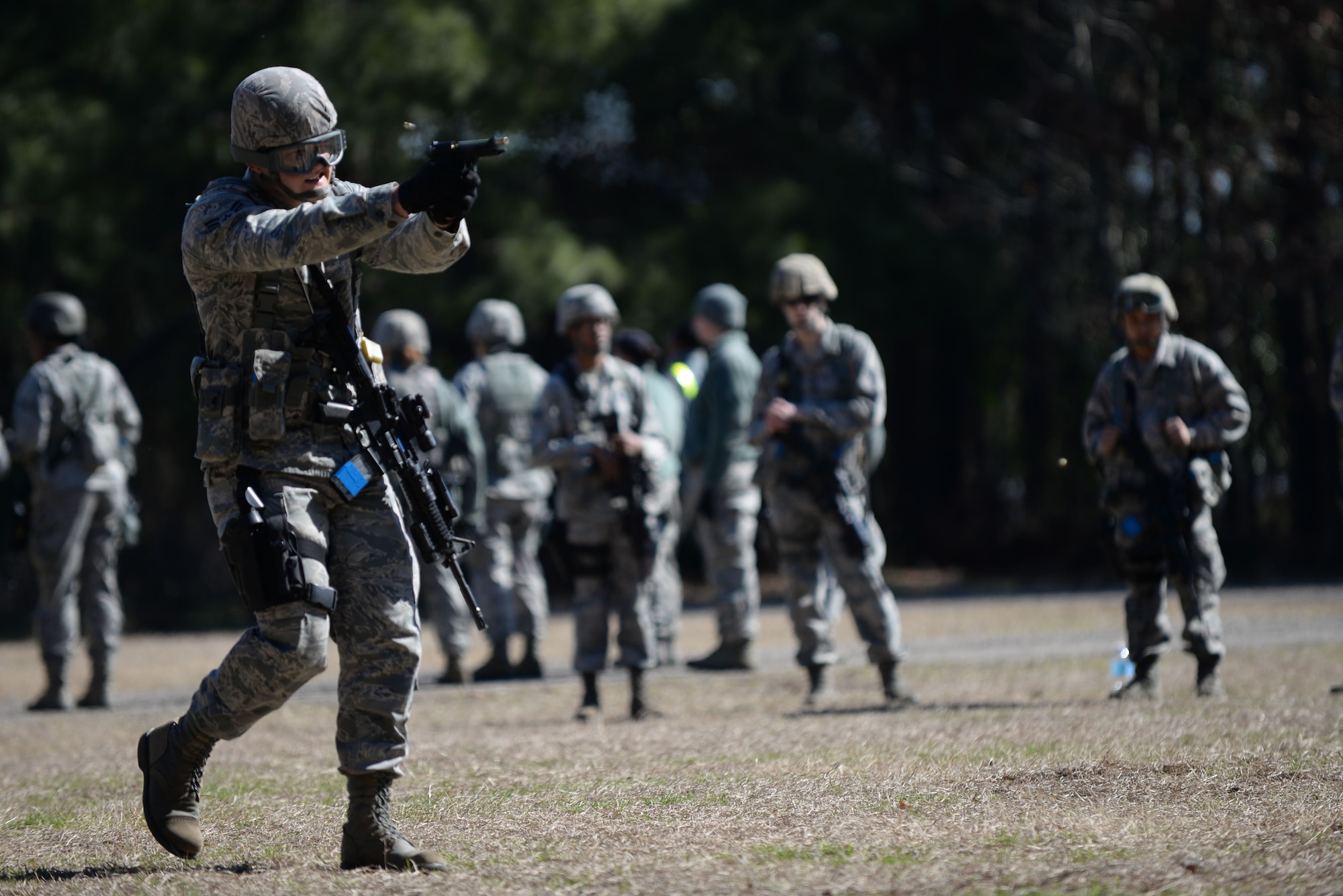 U.S. Air Force Airman 1st Class Timothy “TJ” Knittel, 20th Security Force Squadron security forces specialist, practices M9 movement shooting at Shaw Air Force Base, S.C., Feb. 28, 2014. Knittel, along with approximately 20 other security forces personnel, had a day of training which consisted of two-man movements, advancing on a target while using proper communication and shooting. (U.S. Air Force photo by Airman 1st Class Michael A. Cossaboom/Released)