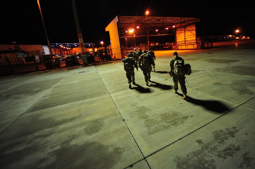 Service members depart the Patriot Express Feb. 25, 2014, Incirlik Air Base, Turkey.  The Patriot Express provides transportation to military personnel who are permanently changing duty stations, along with accompanied family members on dependent status. They also support service members who are en route for temporary duty assignments or deployments. (U.S. Air Force photo by Senior Airman Nicole Sikorski/Released)