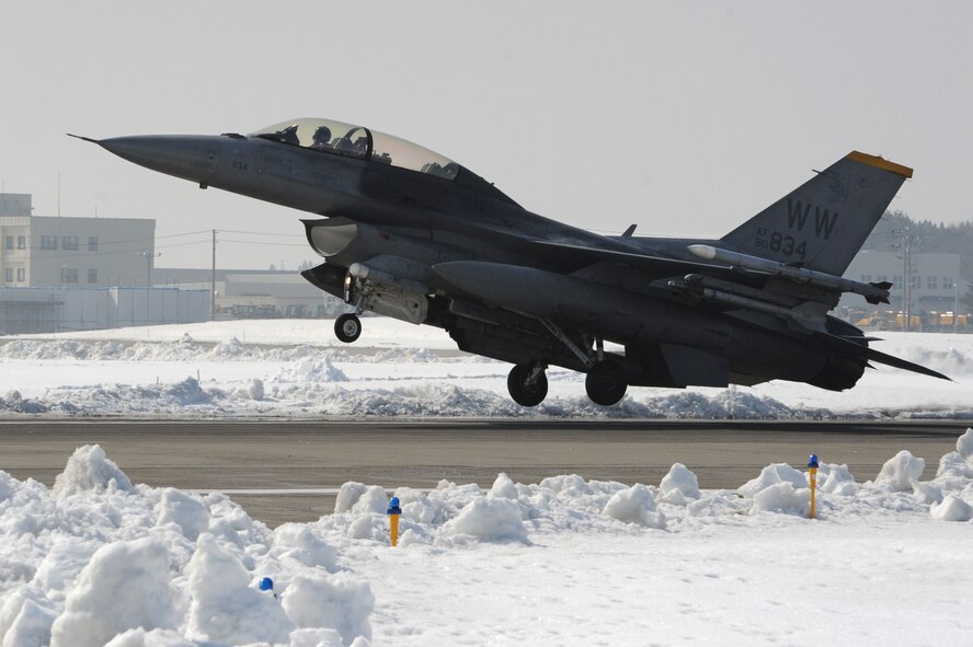 A U.S. Air Force F-16 Fighting Falcon lands after participating in Seikan War, a large force exercise at Misawa Air Base, Japan, Feb. 26, 2014. Seikan War is an annual two-day exercise that trains the Wild Weasels of Misawa AB with the flying forces of the Japan Air Self-Defense Force. (U.S. Air Force photo/Senior Airman Derek VanHorn)