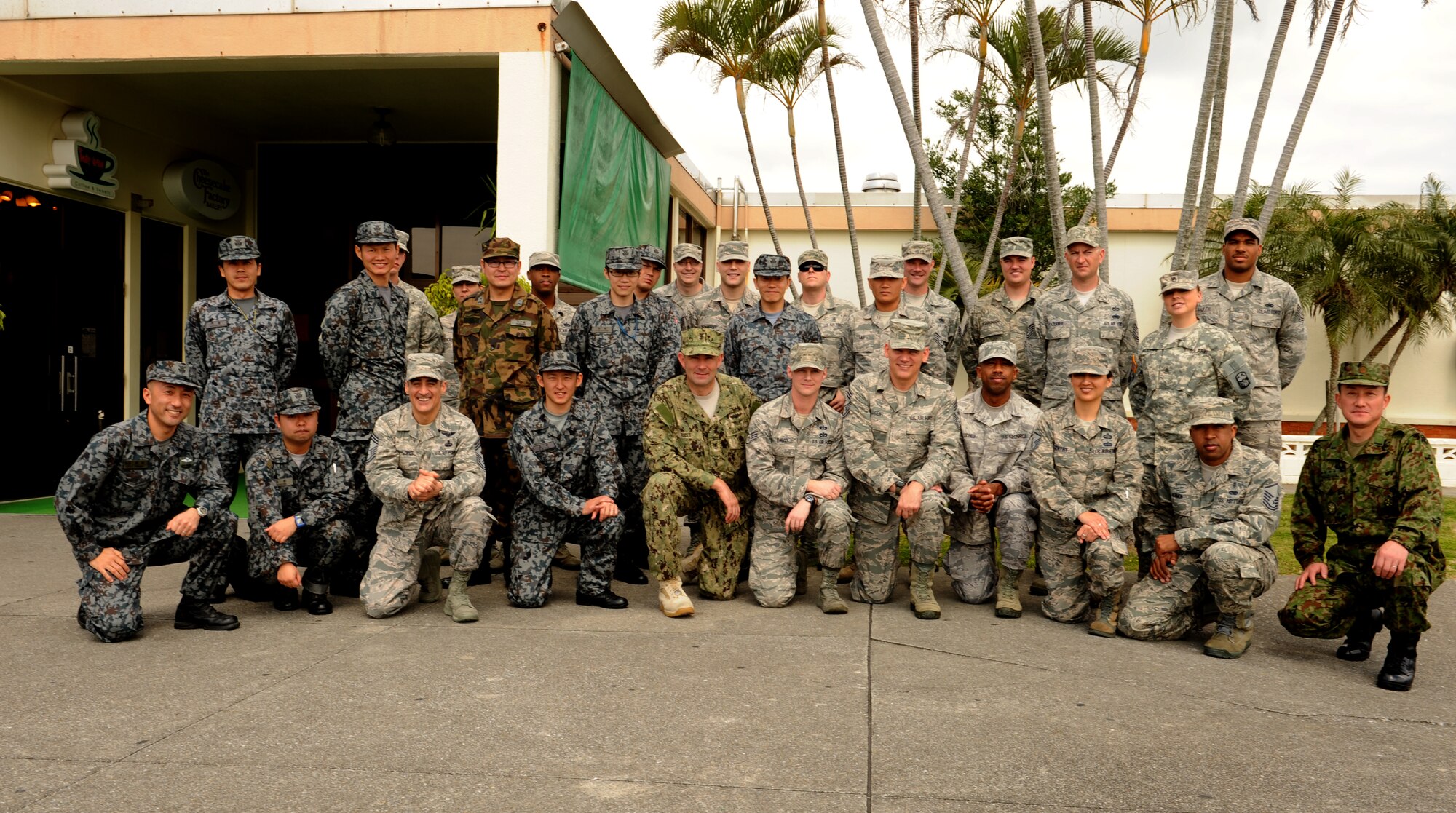 Participants in the Pacific Command Senior Enlisted Leader luncheon take a group photo after eating lunch with U.S. Navy Command Master Chief Mark W. Rudes, Pacific Command senior enlisted leader, on Kadena Air Base, Japan, Feb. 28, 2014. During his visit, Rudes met with Kadena Airmen as well as other U.S. forces stationed as part of a tour throughout the command. He also spoke about budget cuts, force reductions and the need for service members to understand the strategic importance of Okinawa and the necessity to demonstrate good ambassadorship. (U.S. Air Force photo by Airman 1st Class Keith James)