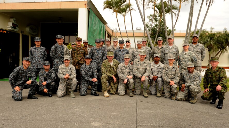 Participants in the Pacific Command Senior Enlisted Leader luncheon take a group photo after eating lunch with U.S. Navy Command Master Chief Mark W. Rudes, Pacific Command senior enlisted leader, on Kadena Air Base, Japan, Feb. 28, 2014. During his visit, Rudes met with Kadena Airmen as well as other U.S. forces stationed as part of a tour throughout the command. He also spoke about budget cuts, force reductions and the need for service members to understand the strategic importance of Okinawa and the necessity to demonstrate good ambassadorship. (U.S. Air Force photo by Airman 1st Class Keith James)