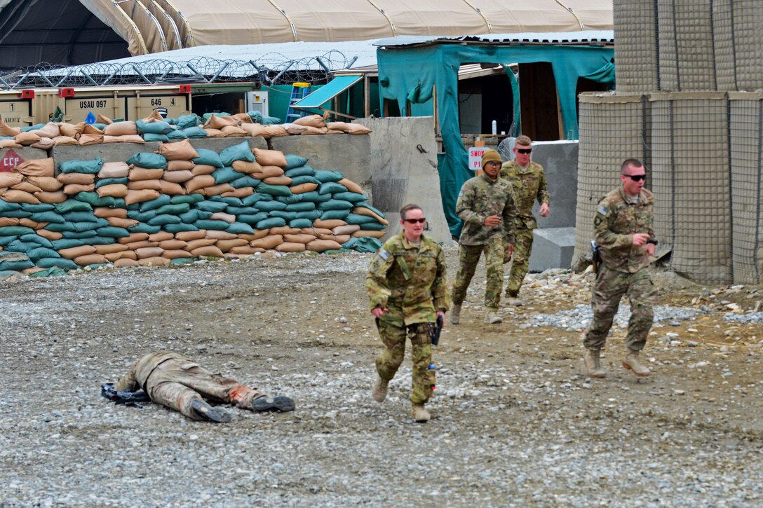 U.S. soldiers rush to assist injured soldiers during a mass casualty exercise on Forward Operating Base Fenty, Afghanistan, Feb. 26, 2014. The soldiers are assigned to 101st Airborne Division's 159th Combat Aviation Brigade. The exercise is designed to keep soldiers’ skills proficient.