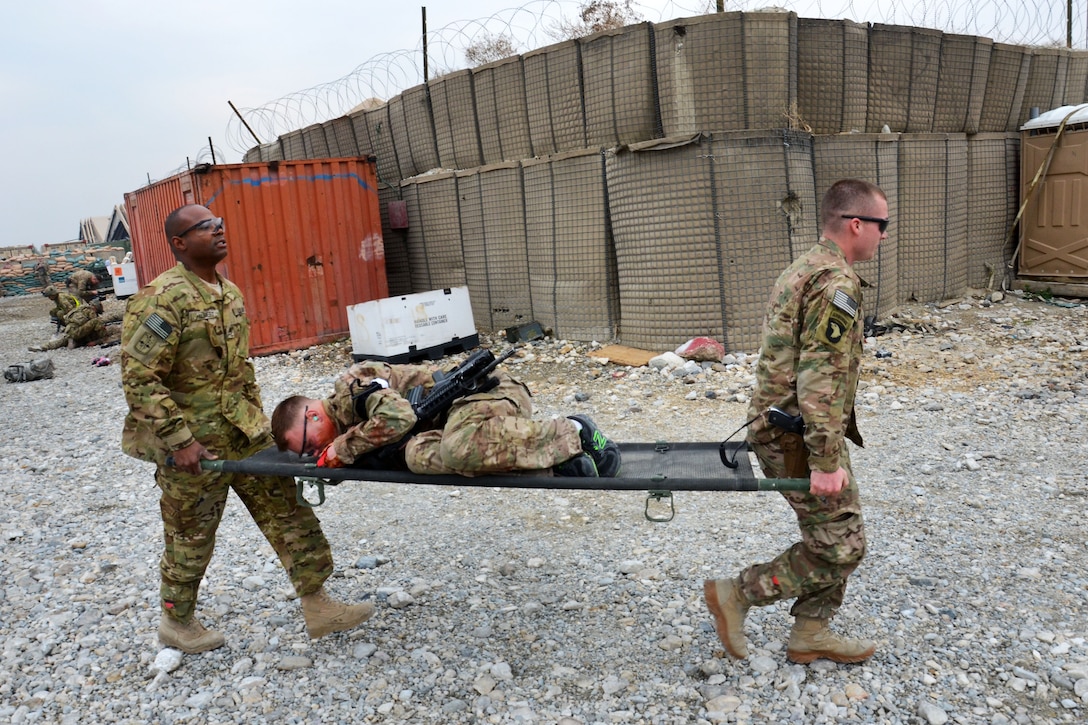 U.S. soldiers liter carry a soldier to the casualty collection point after a simulated attack on Forward Operating Base Fenty, Afghanistan, Feb. 26, 2014.