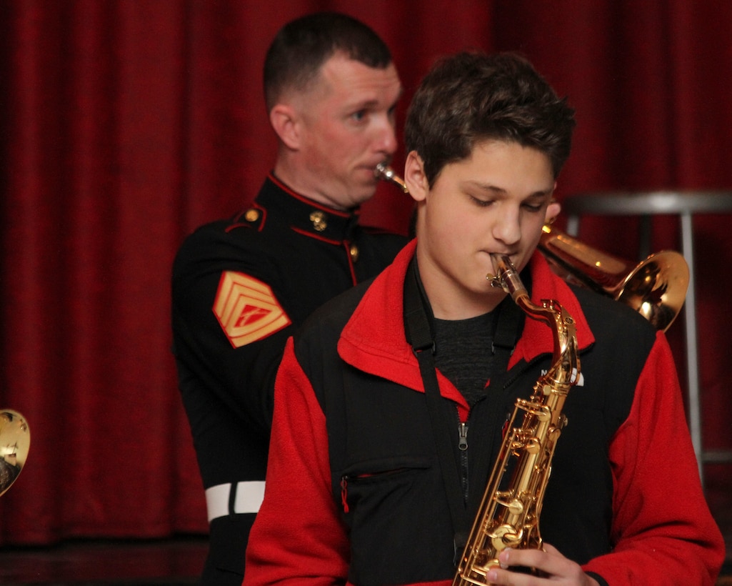 SYOSSET, N.Y. - A. J. Belloco, a music student at Syosset High School, plays with the Marine Corps Jazz Ensemble on March 3 at Syosset High School.  The Marine Corps Jazz Ensemble is performing at several high schools and universities in the Greater New York City and Boston areas with exceptional music programs to promote the Corps’ Musician Enlistment Option Program.  (U.S. Marine Corps photo by Lance Cpl. Brandon Thomas).