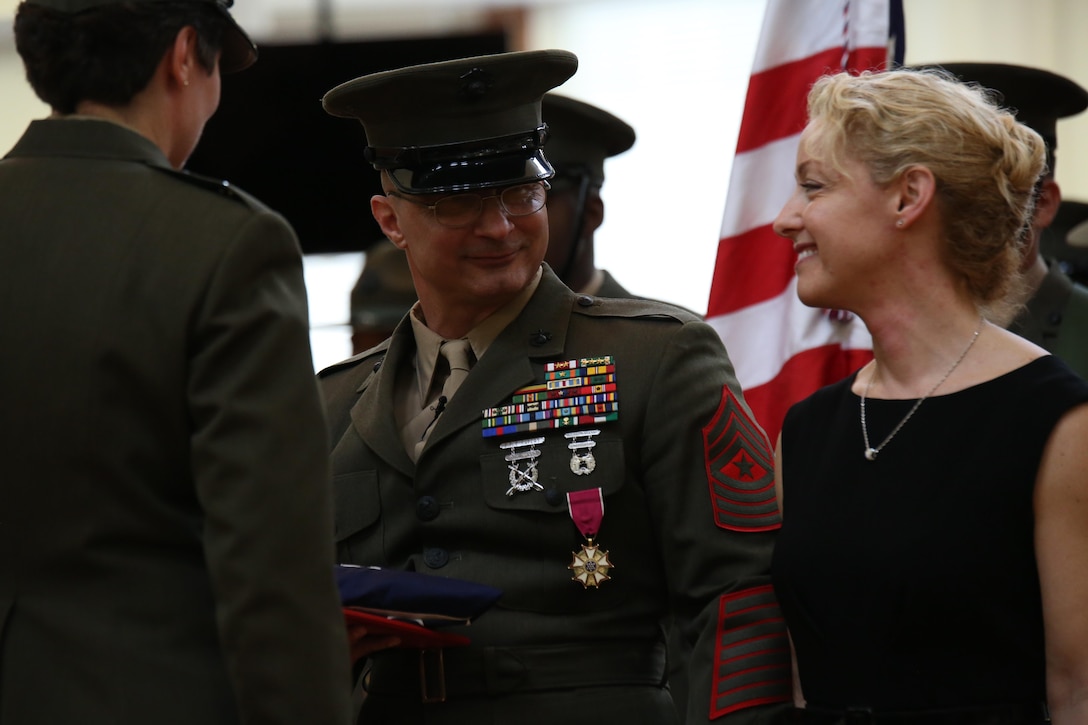 After being relieved of his post, Sgt. Maj. Gary Buck stands with his wife Tammy Buck on Feb. 21, 2014, during a relief and appointment ceremony on Parris Island, S.C. Gary Buck retired after 29 years of service to the Corps and was replaced by Sgt. Maj. Paul Archie.
