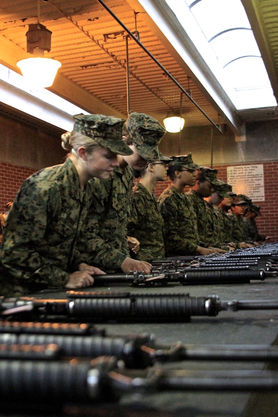 U.S. Marine Corps Pfc. Callahan Brown performs one last inspection of her rifle before she turns it in at the armory aboard Marine Corps Recruit Depot Parris Island, S.C. She is the Company Honor Graduate from Platoon 4007,Papa Co., 4th Recruit Training Battalion, graduated Feb. 28, 2014. She was recruited for Recruiting Station Frederick by Staff Sgt. Craig Taylor out of Springfield, Va. (U.S. Marine Corps photo by Sgt. Amber Williams/Released)