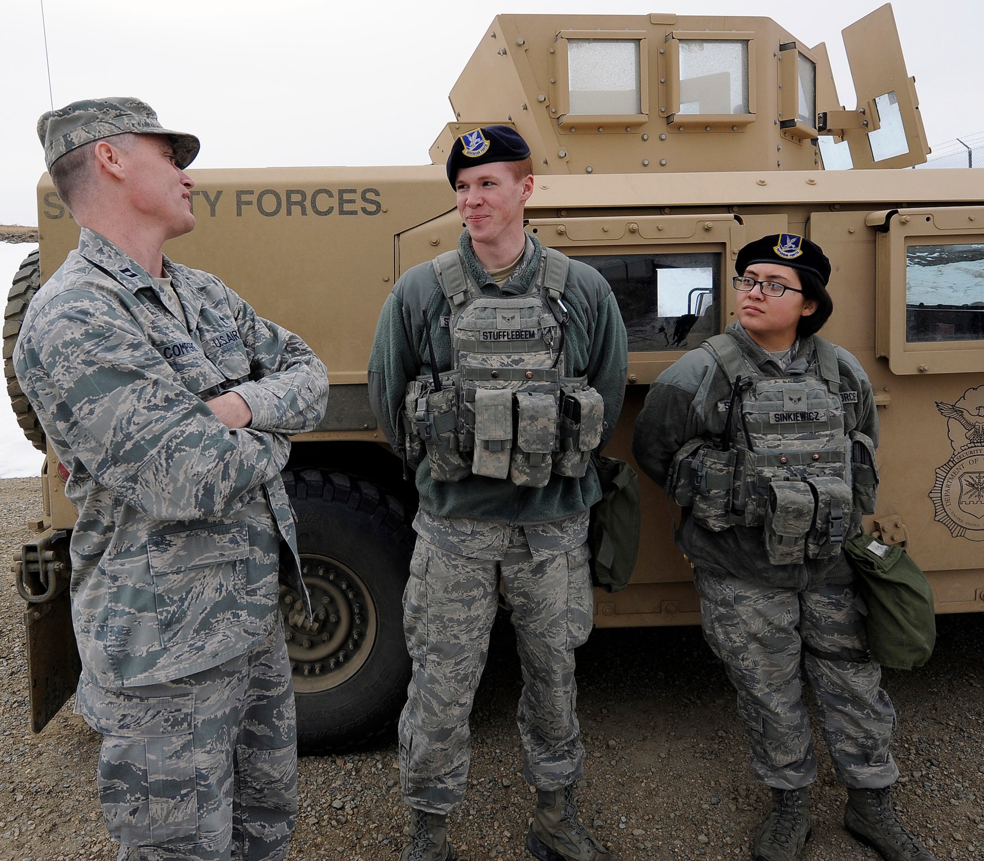 Chaplain (Capt.) Robert Compere (left) speaks with Airmen in the missile field Feb. 20, 2014, at Malmstrom Air Force Base, Mont. Malmstrom AFB's Chaplain Corps cover the entire 13,800-square-mile missile complex, including the base. Compere is a 341st Missile Wing chaplain. (U.S. Air Force photo/Airman 1st Class Collin Schmidt)
