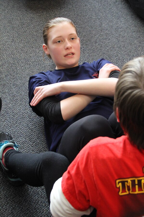 Poolee Abby Thomas of Recruiting Substation Lakewood performs crunches during a station pool function held at the RSS on February 19, 2014. When Thomas was not able to join last year because she could not obtain parental consent, she continued to attend pool functions and better herself until she turned 18 and was able to join on her own. The Cleveland native will be going to recruit training at Marine Corps Recruit Depot Parris Island, S.C. to earn the title Marine in April.  (U.S. Marine Corps photo by Sgt. T.M. Stewman/Released)