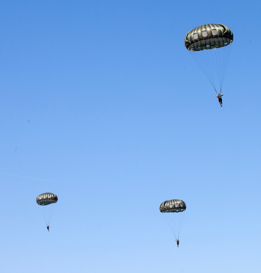 Marines with Force Company, 2nd Reconnaissance Battalion, 2nd Marine Division, parachute during a rehearsal jump Feb. 18, 2014 at Marine Corps Base Camp Lejeune, N.C. Marines jumped in sticks of six-to-eight man teams. 
