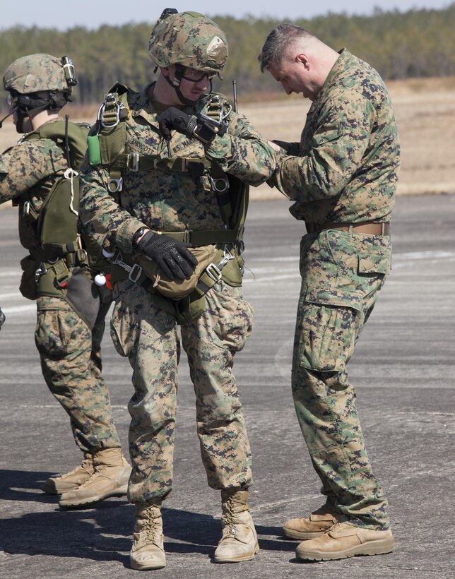 Sergeant Trent Endicott (left), a reconnaissance man with Force Company, 2nd Reconnaissance Battalion, 2nd Marine Division, gets his parachute apparatus checked one last time by Master Sgt. Brad Dean(right), the jumpmaster, before entering a V-22 Osprey for a rehearsal jump Feb. 18, 2014 at Marine Corps Base Camp Lejeune, N.C. Endicott is part of a new team being formed, known as Delta Detachment, for the 24th Marine Expeditionary Unit’s  upcoming deployment in 2015. 