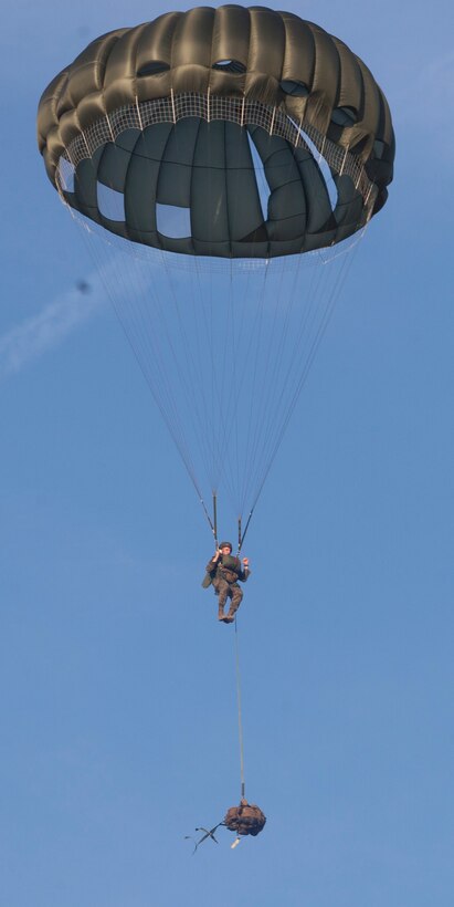 A Marine with Force Company, 2nd Reconnaissance Battalion, 2nd Marine Division, parachutes to the ground with his rucksack below him during a three-day, training exercise at Marine Corps Base Camp Lejeune, N.C., Feb. 18, 2014. Once on the ground, the Marines regrouped and patrolled more than five miles to their objective to observe enemy forces for three days and two nights. The exercise tested the Marines’ ability to observe and report from clandestine locations around an enemy stronghold. 