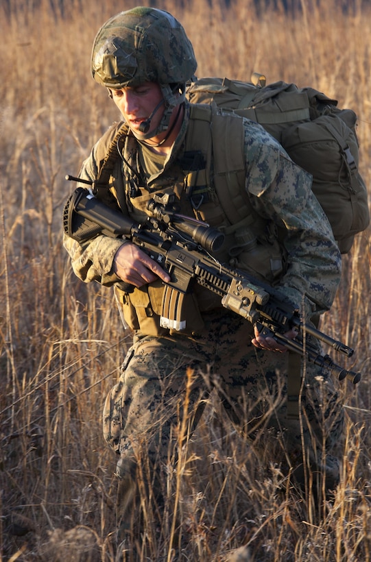 Lance Cpl. Blake Thoreso, a reconnaissance man with Force Company, 2nd Reconnaissance Battalion, 2nd Marine Division, patrols on foot during a training exercise Feb. 18, 2014 at Camp Lejeune, N.C. Reconnaissance teams operate in small teams to observe and report to higher commands the enemy’s location, troop size, equipment, routine and uniforms, in order to paint a picture for key leaders to make effective and precise decisions when choosing the best method for closing with and destroying the enemy. 