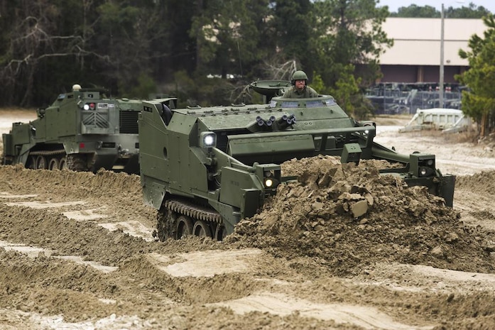 Robert Kubach, operations chief for 2nd Combat Engineering Battalion and Cleveland native, operates the improved M9 Armored Combat Earthmover during a familiarization exercise Feb. 26 in Camp Lejeune, N.C. The M9 ACE is an improved version of the Legacy ACE. It has an upgraded and reinforced hull, more powerful engine and improved hydraulic system.  