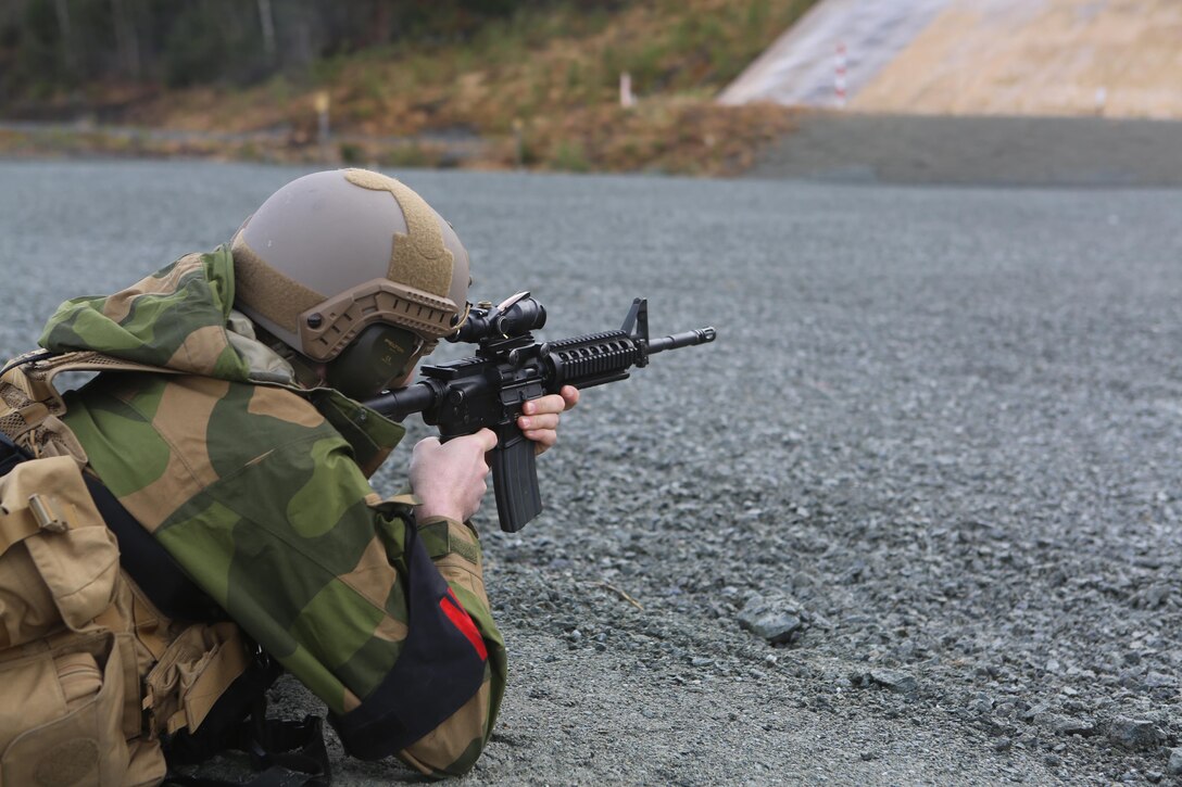Cpl. Robert T. Kolberg, a Roros, Norway, native and military policeman with Home Guard District 12 prepares to fire an M-4 belonging to a military policeman with 2nd Supply Battalion, Combat Logistics Regiment 25, 2nd Marine Logistics Group at a firing range at Frigaard, Norway, Feb. 25, 2014. The MPs from both nations used their time together as an opportunity to learn about each other’s operations, equipment and weapons before Cold Response 2014. Cold Response 2014 is a Norwegian-led multinational exercise above the Arctic Circle designed prepare for crisis response operations.