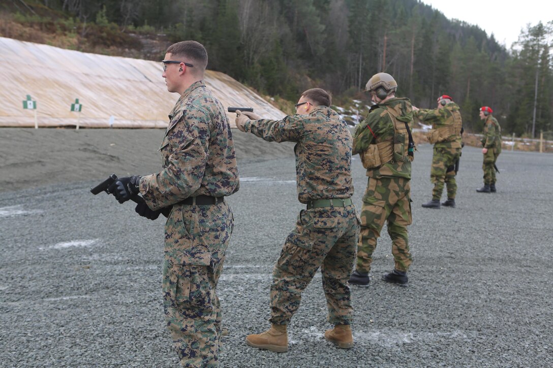 Military policemen with 2nd Supply Battalion, Combat Logistics Regiment 25, 2nd Marine Logistics Group and Home Guard District 12 practice firing a Glock P-80s at a firing range at Frigaard, Norway, Feb. 25, 2014. The Glocks, commonly used by the Norwegian army, gave Marine MPs a chance to hone their marksmanship skills and gain a greater understanding of Norwegian equipment before Cold Response 2014. Cold Response 2014 is a Norwegian-led multinational exercise above the Arctic Circle designed prepare for crisis response operations.