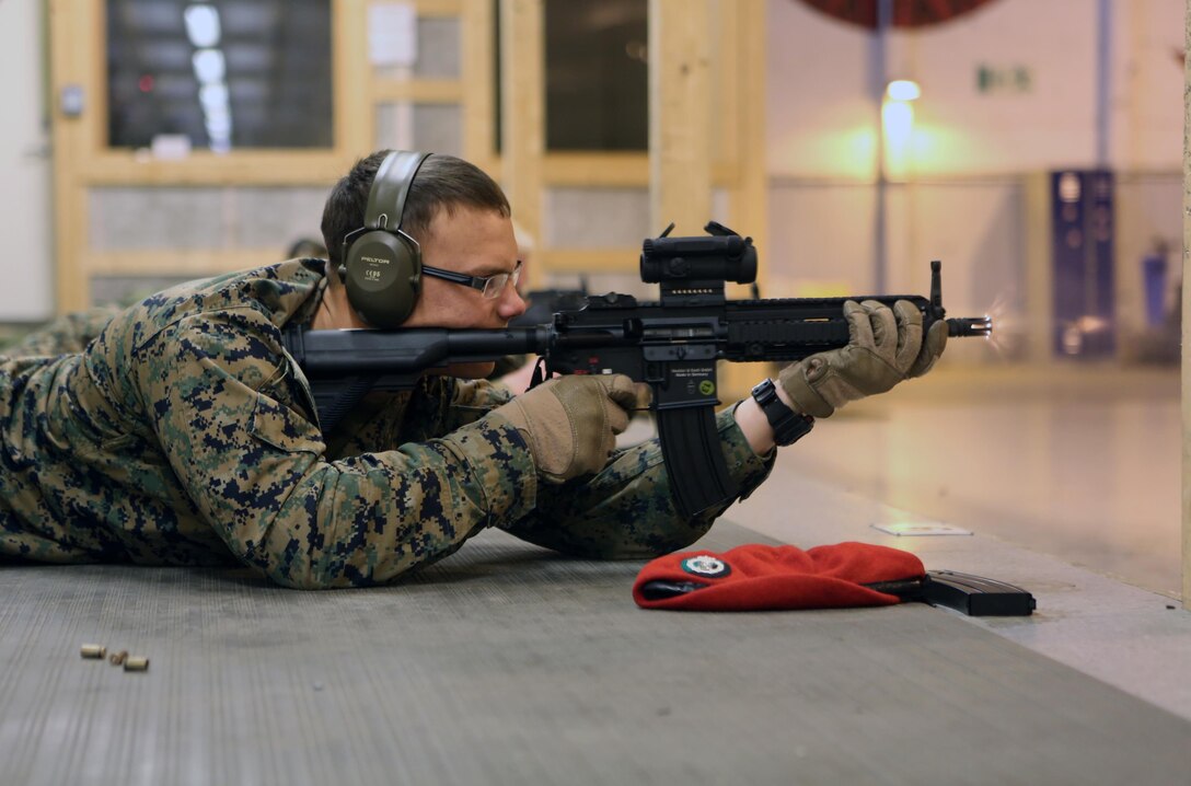 Lance Cpl. Tyler Riggs, a military policeman with 2nd Supply Battalion, Combat Logistics Regiment 25, 2nd Marine Logistics Group, fires an HK-416K assault rifle in an indoor firing range at Vaernes Garrison, Norway, Feb. 21, 2014. The cross training gave MPs from both nations valuable knowledge prior to working with each other during Cold Response 2014. Cold Response 2014 is a Norwegian-led multinational exercise above the Arctic Circle designed prepare for crisis response operations.