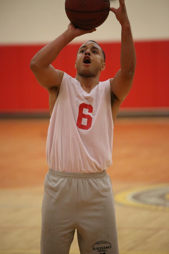 Miguel Cespedes, an Enlisted Instructor Platoon player, prepares to take a foul shot during an intramural basketball game against the Weapons Training Battalion at the Barber Physical Fitness Activity on Feb. 25, 2014. EIP lost 52-34. 