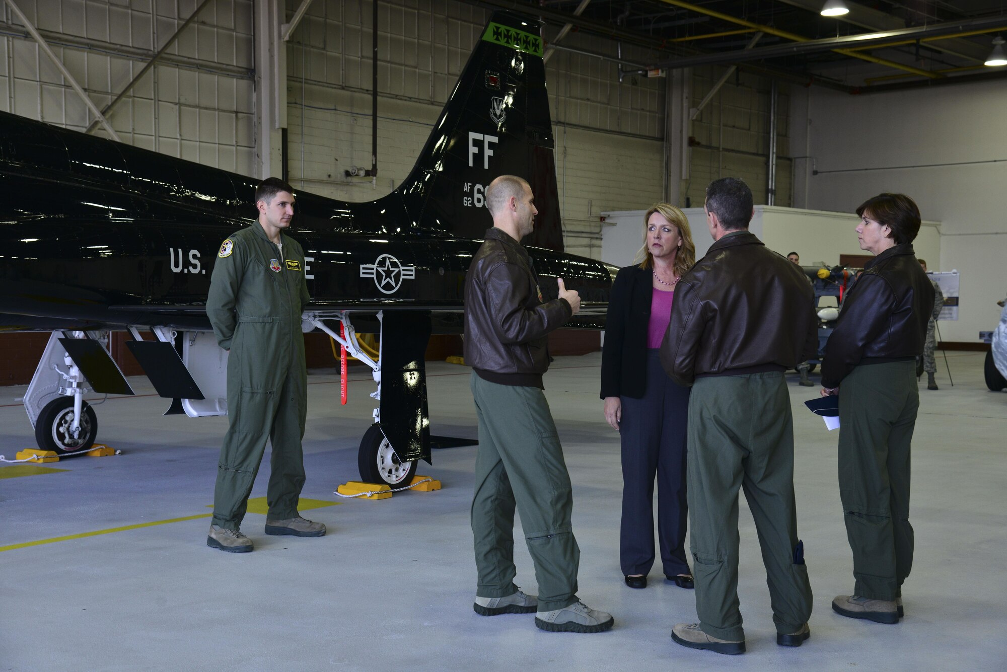 Secretary of the Air Force Deborah Lee James is met by Col. Matthew Venzke and Col. Edward Corcoran at the 1st Fighter Wing hangar Feb. 27, 2014, at Langley Air Force Base, Va. At the hangar, James was briefed about the F-22 Raptor’s mission overview and proficiency. Venzke is the 1st Maintenance Group commander and Corcoran is the 1st Operations Group commander. (U.S. Air Force photo/Senior Airman Aubrey White) 