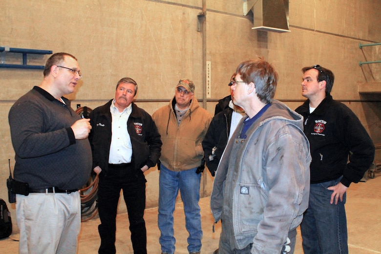 Mike Welch, Gavins Point Power Plant Superintendent, welcomes members of the Yankton, S.D. fire rescue team to the project. Should an accident occur while work is taking place at the project, the Yankton Fire Department may be among some of the first responders on scene. Welch invited the crew to see what access to the draft tube would be like if they ever needed to perform a rescue.