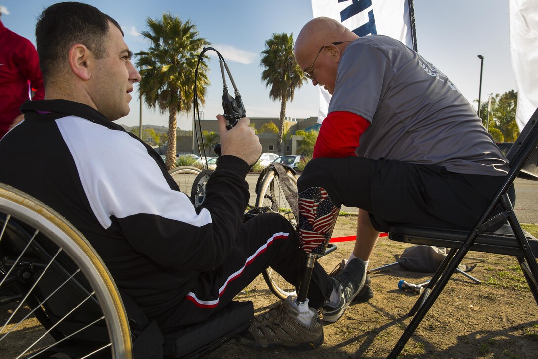 Cpl. Jimsher Chkhenkeli, left, an international athlete from Georgia, gets fitted for a recumbent bicycle with the assistance of Dan O’Connor, the cycling coach for Wounded Warrior Regiment, during the 2014 Marine Corps Trials March 4. 

Piper is currently assigned to Wounded Warrior Battalion West. The Marine Corps Wounded Warrior Regiment enables wounded, ill or injured Marines to focus on their abilities and to find new avenues to thrive.  

The fourth annual Marine Corps Trials is being held at Marine Corps Base Camp Pendleton, Calif., March 4-12. Athletes will compete in archery, cycling, shooting, swimming, track, field, sitting volleyball and wheelchair basketball.  