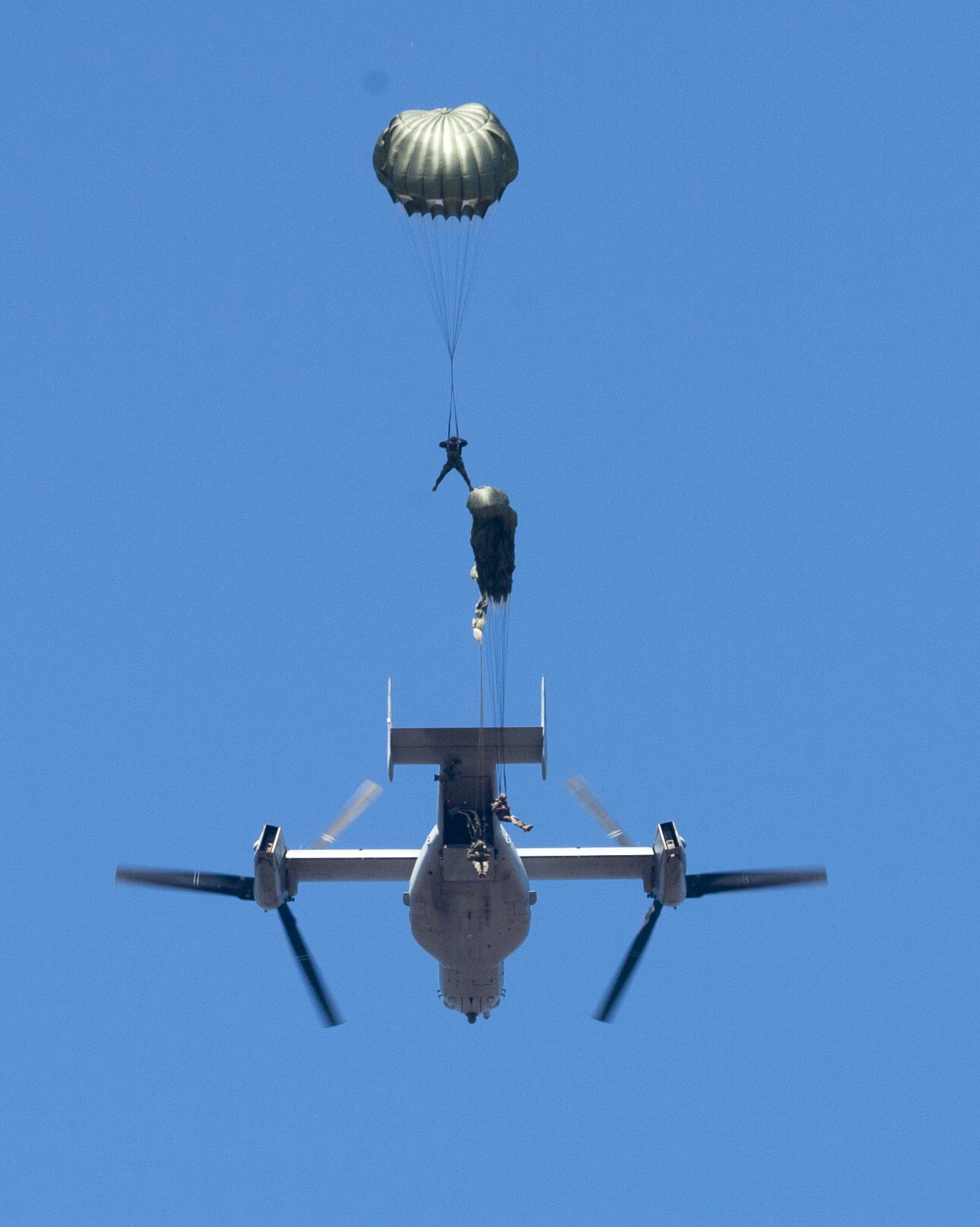 Reconnaissance Marines with Force Company, 2nd Reconnaissance Battalion, 2nd Marine Division, jump from the back of a V-22 Osprey during a rehearsal jump before conducting a three-day exercise Feb. 18, 2014 at Marine Corps Base Camp Lejeune, N.C. The rehearsal jump re-familiarized Marines with jump procedures and helped each member of the team walk through his responsibility before jumping for the exercise a few hours later. 