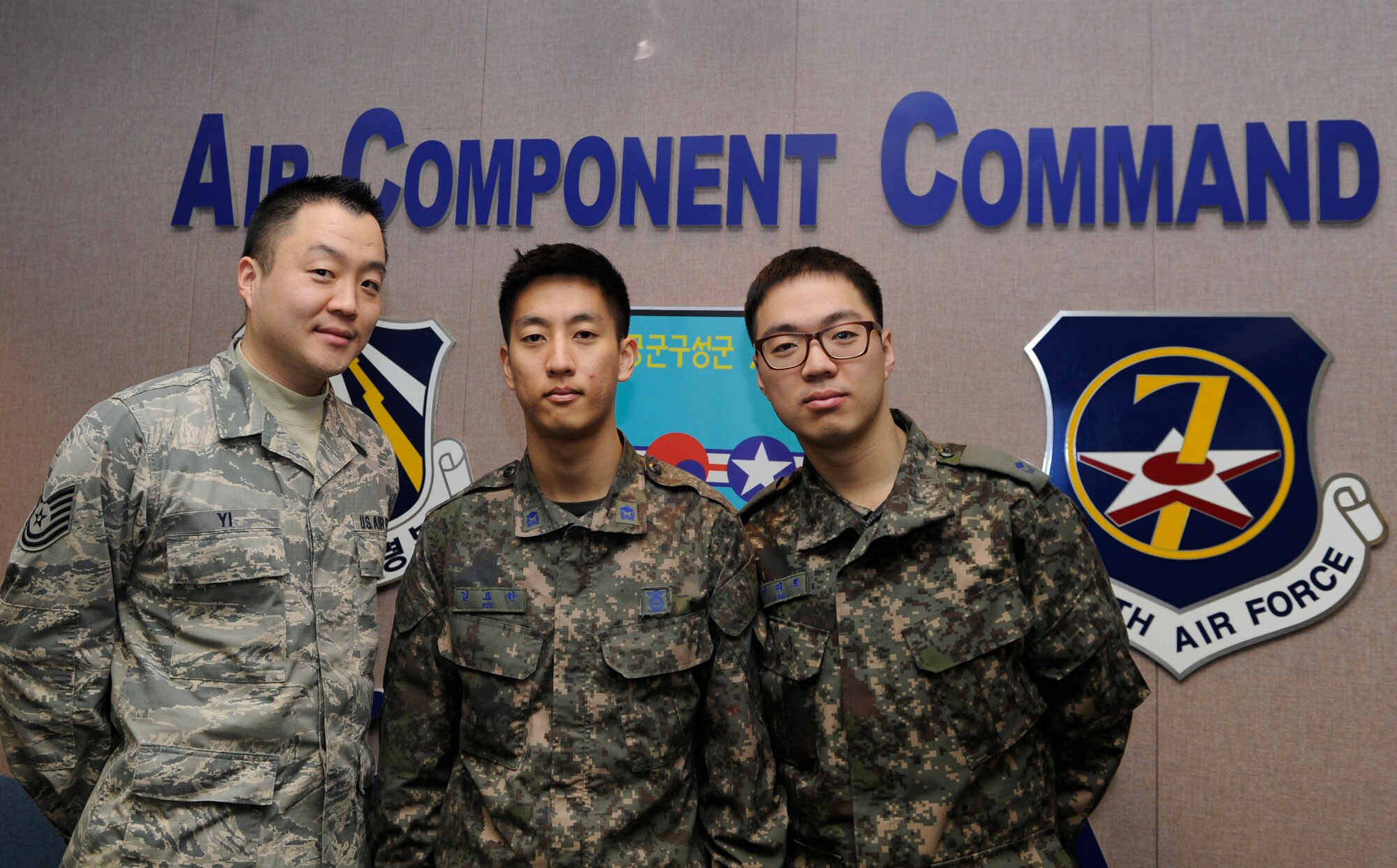 U.S. Air Force Tech Sgt. Isaac Yi and Republic of Korea Air Force 2nd Lts. Yohan Kim and Wero Jung with the 7th Air Force Air Component Command Plans and Coordination Division, serve as linguists during Exercise Key Resolve 2014 at Osan Air Base, Republic of Korea, March 6, 2014.  Linguists translate and transcribe key messages between the Republic of Korea and U.S. Air Force. (U.S. Air Force photo/Airman 1st Class Omari Bernard)