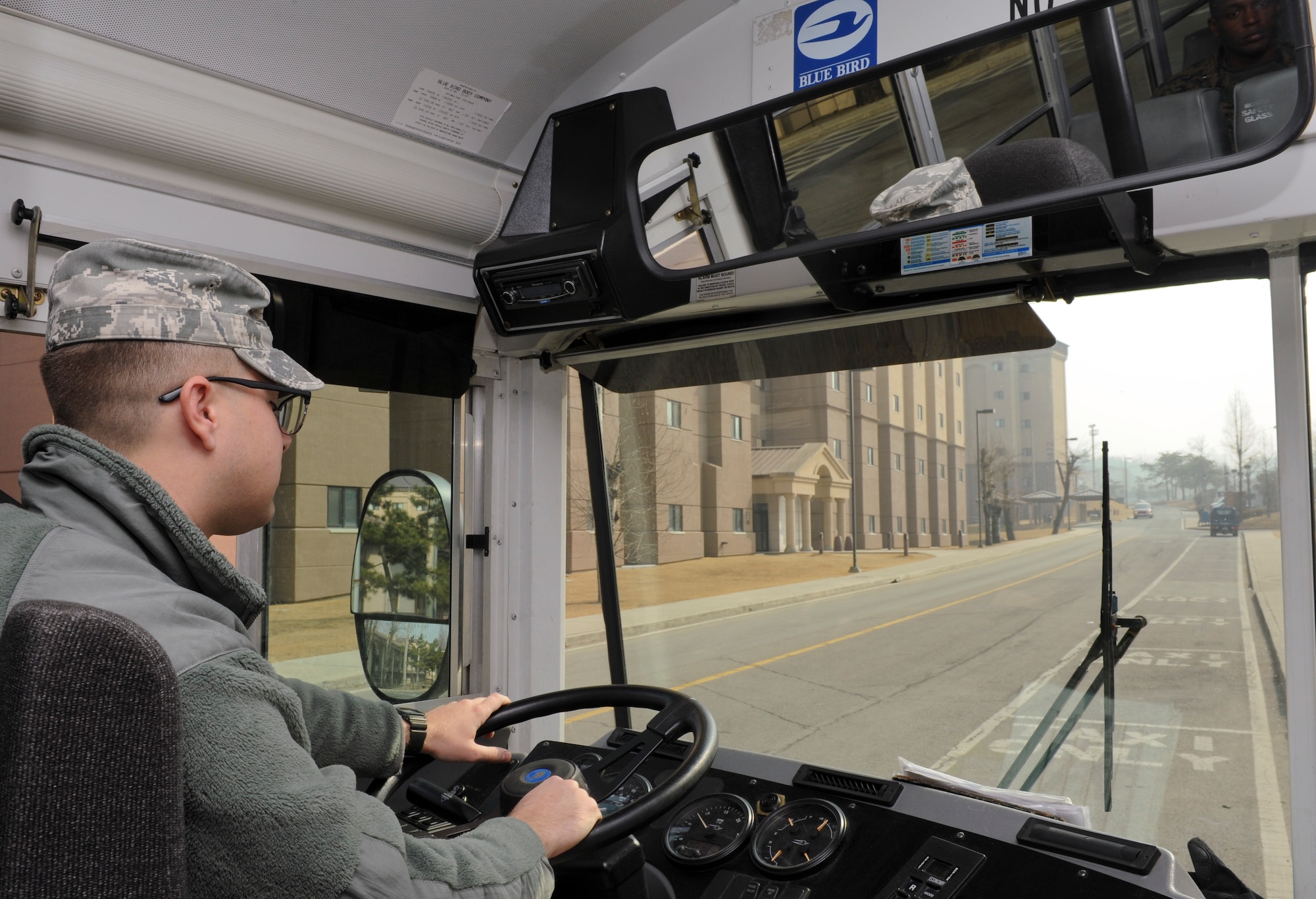 Airman 1st Class Sean Humphrey, a vehicle operator with the 18th Logistics Readiness Squadron at Kadena Air Force Base, Japan, drives U.S. Armed Forces to and from their destinations at Osan Air Base, Republic of Korea, Feb. 26, 2014. Airmen with the 18 LRS transport augmentees in support of Exercise Key Resolve 2014. (U.S. Air Force Photo/Airman 1st Class Omari Bernard)