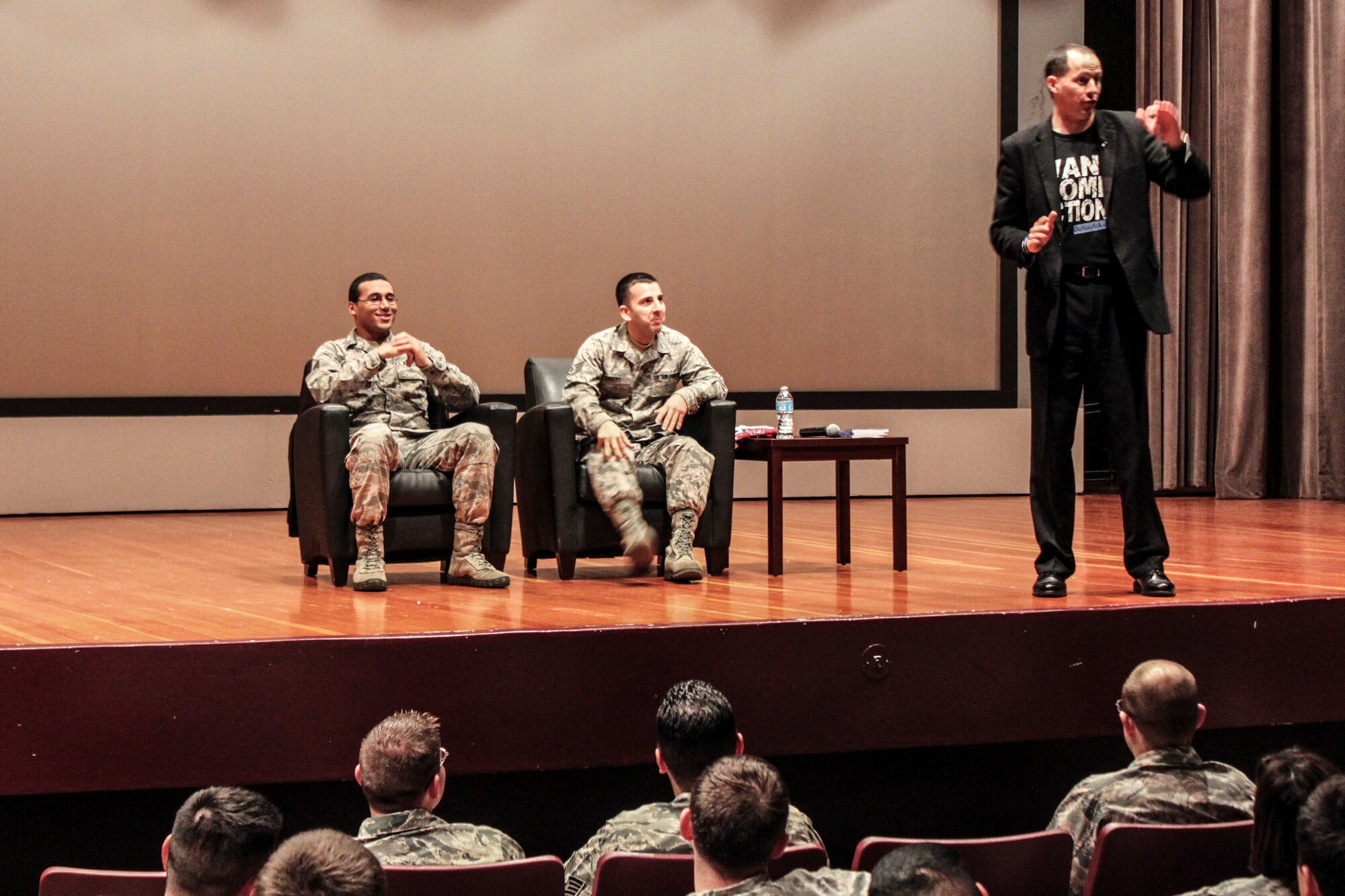 (From left to right) Senior Airman David Woods, 381st Training Support Squadron and Staff Sgt. Ricardo Castro, 532nd Training Group, participate on-stage during a presentation by author and comedian Mike Domitrz called, "Can I Kiss You?" Feb. 28 here. Domitrz,founder of The Date Safe Project, uses humor and audience participation to talk about consent, bystander intervention and supporting survivors of sexual assault. (U.S. Air Force photo/ Senior Airman Shea Harris)
