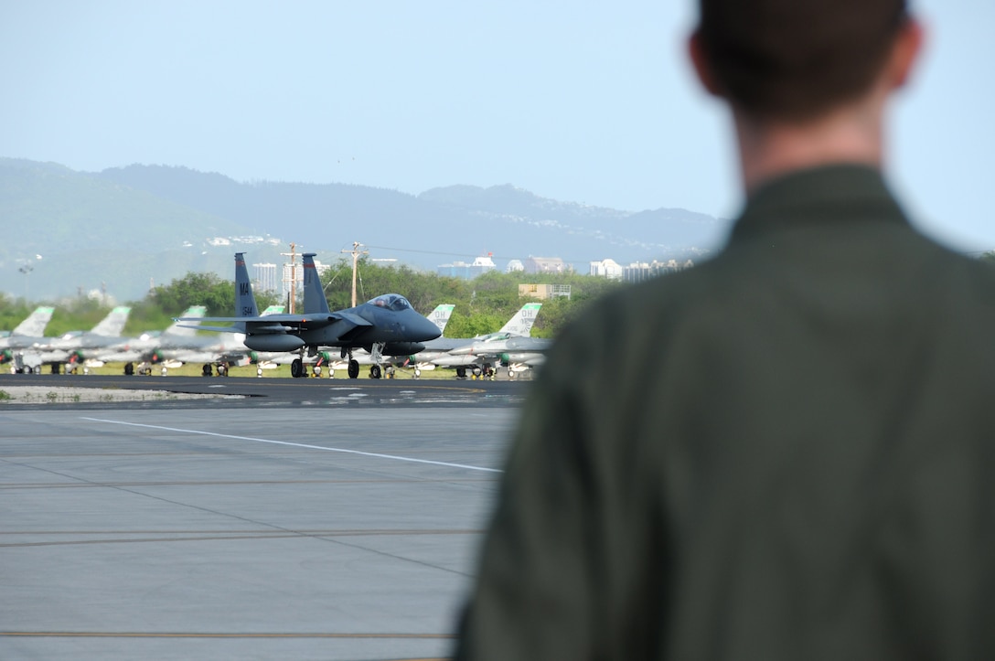 F-15 Eagles from the 104th Fighter Wing, Barnes Air National Guard Base, Westfield, Mass., arrive March 4, 2014, at Joint Base Pearl Harbor-Hickam, Hawaii, to participate in the largest Sentry Aloha exercise to date. The focus of the training will be on large scale mission scenarios that allow our F-15 pilots to practice aircraft collaboration with F-22 Raptors in a simulated combat environment. (U.S. Air National Guard photos by 2nd. Lt. Anthony Mutti/Released)