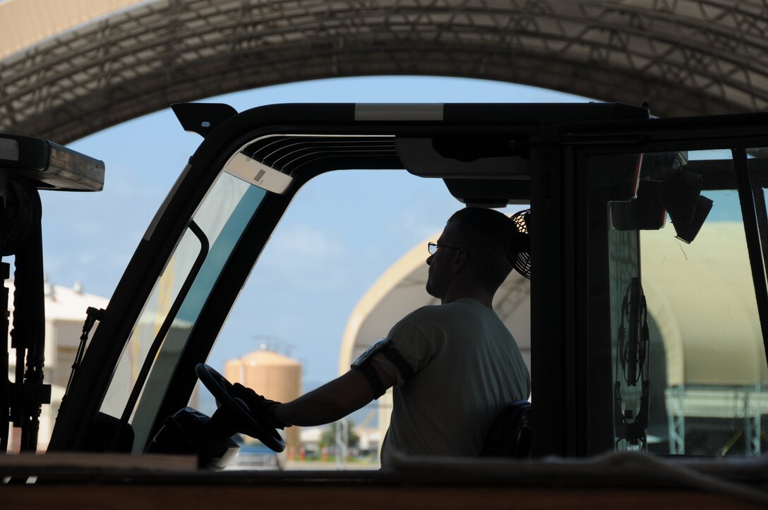 Master Sgt. Wade Rivest, 104th Fighter Wing Crew Chief Supervisor, organizes 104th Fighter Wing maintenance assets with a forklift, in support of Sentry Aloha, Joint Base Pearl Harbor-Hickam, Hawaii, March 4, 2014. (U.S. Air National Guard photos by 2nd. Lt. Anthony Mutti/Released)