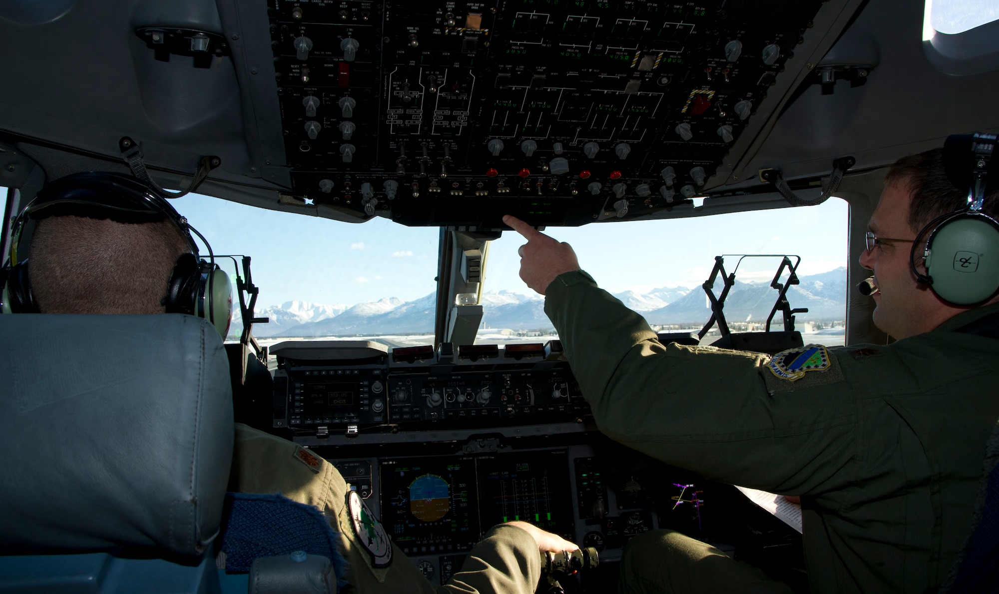 Air Force majors Joe Beal, pilot, and Jon Highley, copilot, prepare for take-off before a personnel air drop from a C-17 Globemaster III from the 517th Airlift Squadron over Malemute Drop Zone at Joint Base Elmendorf-Richardson, Alaska, Feb. 27, 2014. (U.S. Air Force photo/Staff Sgt. Sheila deVera)