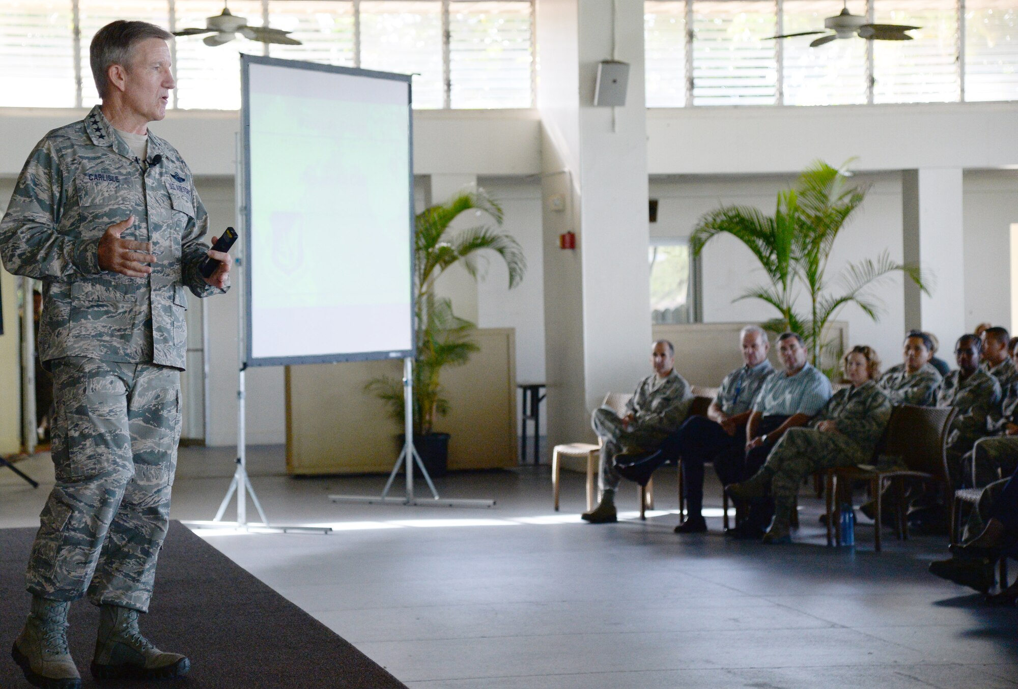 Gen. Hawk Carlisle, commander of Pacific Air Forces, speaks with 15th Wing Airmen during a Hickam All Call at Joint Base Pearl Harbor-Hickam, Hawaii, March 4, 2014. General Carlisle spoke about challenges the Air Force faces now and in the future, and highlighted the importance of maintaining hard work, dedication and togetherness while dealing with the challenges. (U.S. Air Force photo/Staff Sgt. Alexander Martinez)