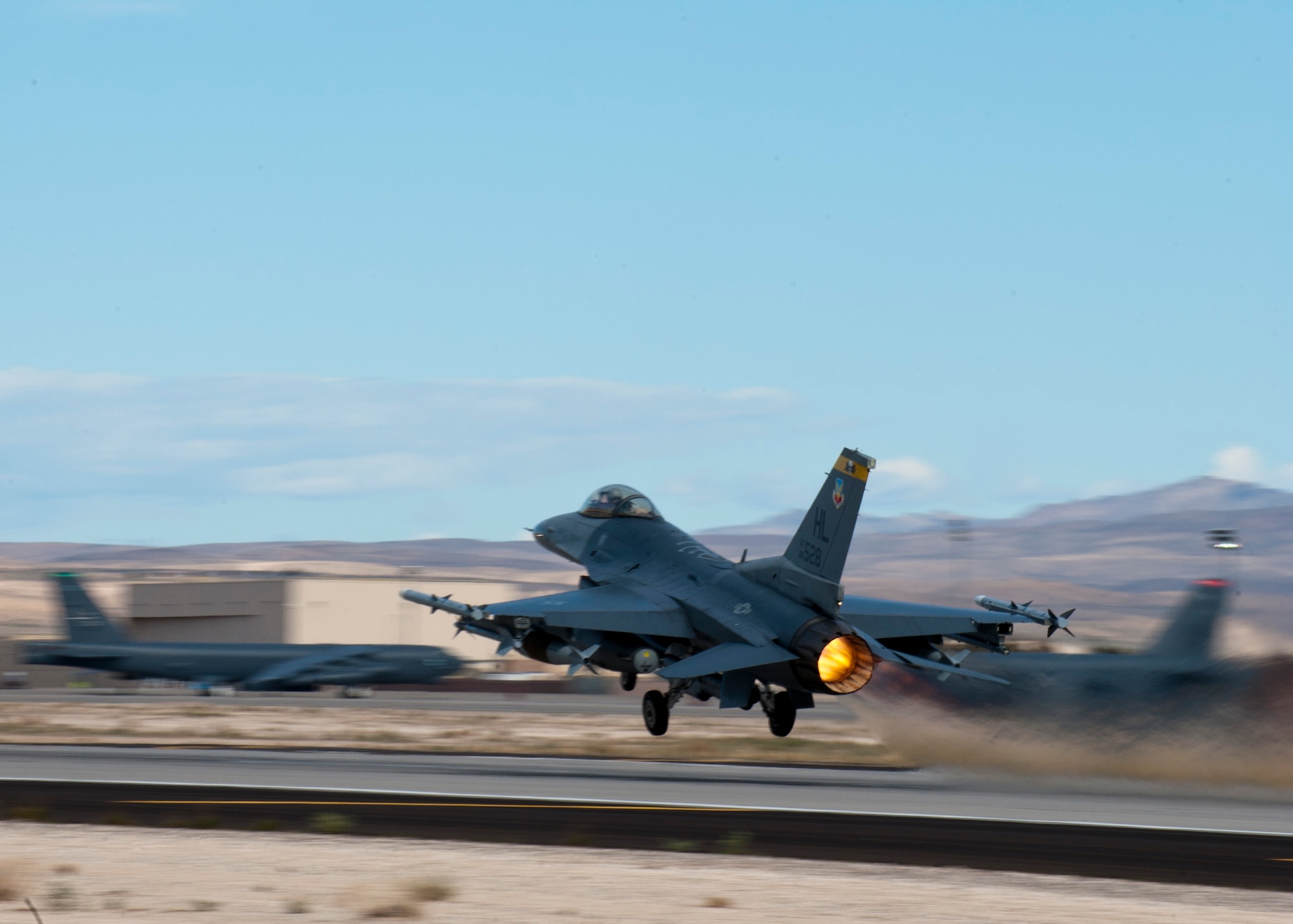 A U.S. Air Force F-16 Fighting Falcon assigned to the 4th Fighter Squadron from Hill Air Force Base, Utah takes off during Red Flag 14-2 March 4, 2014, at Nellis AFB, Nev. Red Flag was developed to better prepare Airmen for combat missions. Since its establishment in 1975, Red Flag has expanded to include aircraft and crews from different branches of the U.S. and allied nation’s militaries. (U.S. Air Force photo by Airman 1st Class Thomas Spangler) 