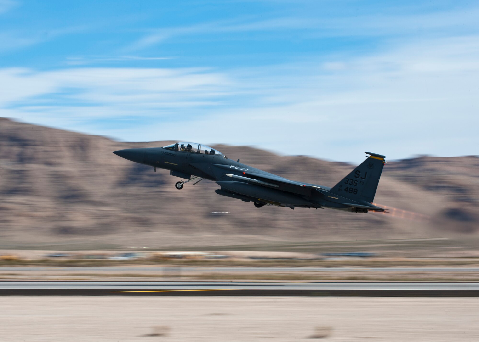 A U.S. Air Force F-15E Strike Eagle assigned to the 336th Fighter Squadron from Seymour Johnson Air Force Base, N.C. takes off during Red Flag 14-2 March 4, 2014, at Nellis AFB, Nev. Red Flag gives Airmen an opportunity to experience realistic combat scenarios which prepares them for potential future real world operations. (U.S. Air Force photo by Airman 1st Class Thomas Spangler)
