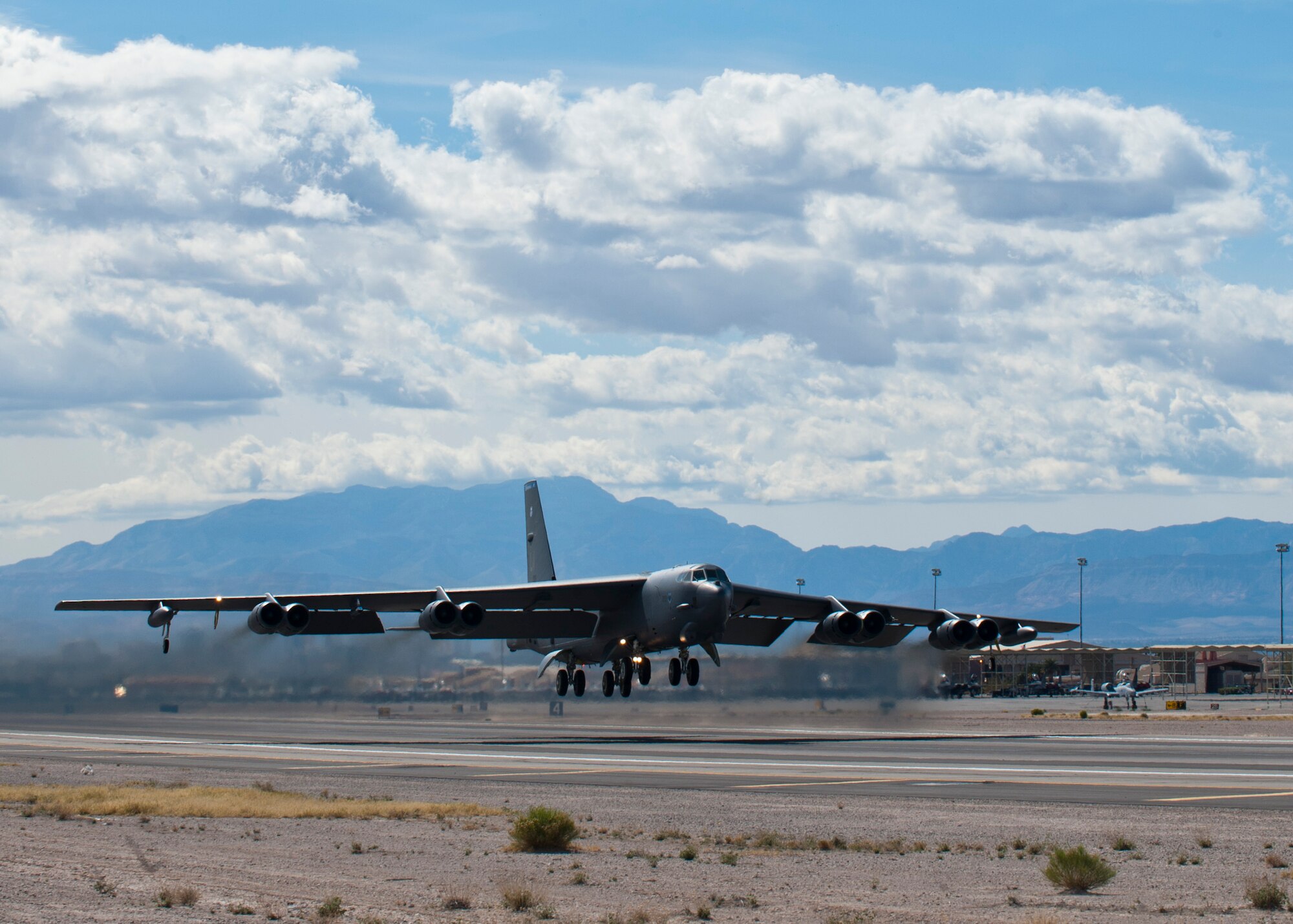 A U.S Air Force B-52 Stratofortress assigned to the 96th Bomb Squadron from Barksdale Air Force Base, La. takes off during Red Flag 14-2 March 4, 2014, at Nellis AFB, Nev. Red Flag provides realistic combat scenarios in a training environment that improve operational readiness. Improved readiness will ensure that crews are better prepared to successfully accomplish future real world missions. (U.S. Air Force photo by Airman 1st Class Thomas Spangler)