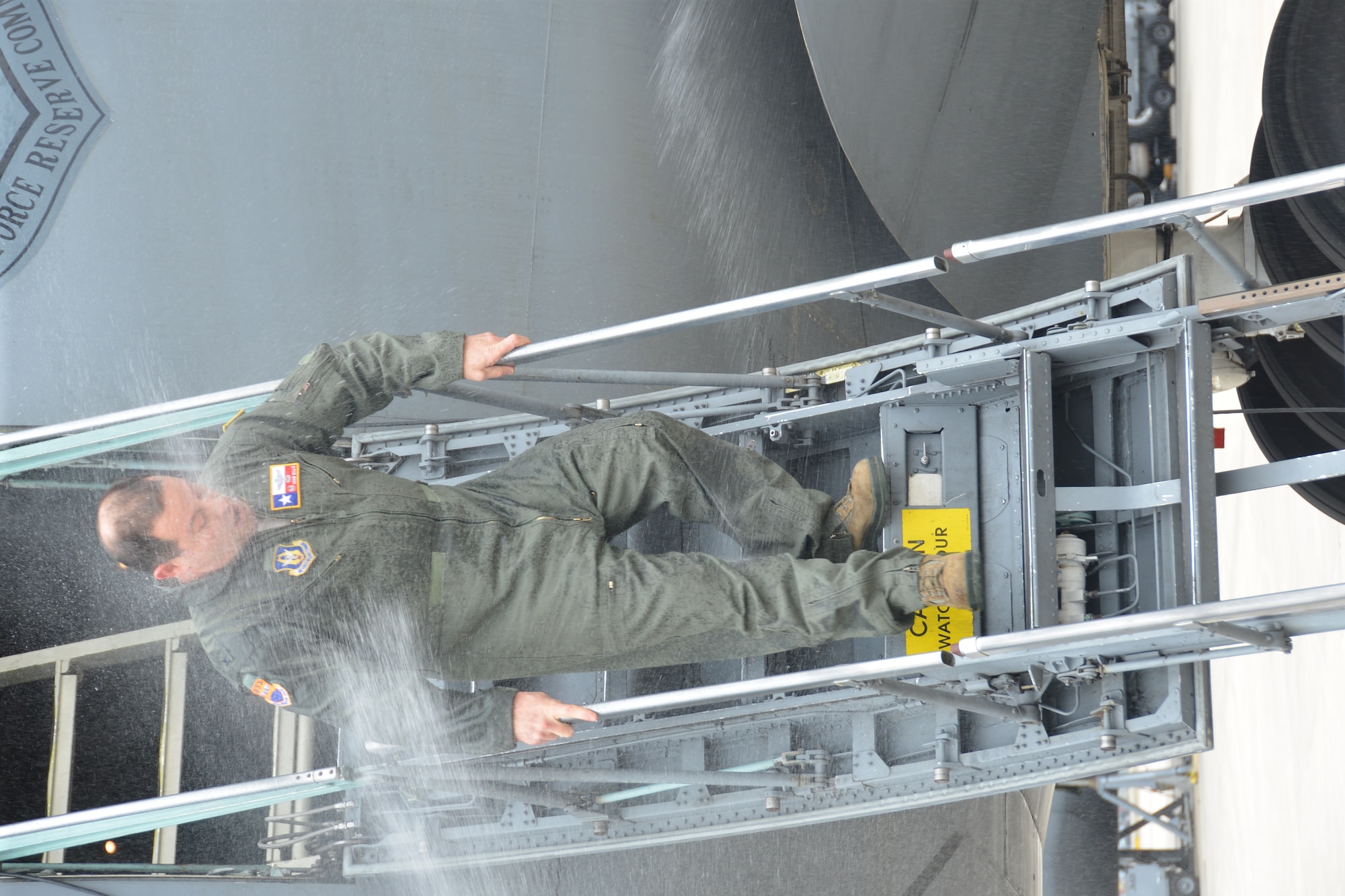 Members of the 433rd Operations Group greet Col. Adam Willis, 433rd Operations Group commander with a spray of water after his fini flight, Mar. 4, 2014, at Joint Base San Antonio-Lackland, Texas. The “fini-flight” is a time-honored military aviation tradition that marks the last flight of a pilot’s time with a squadron. Willis leaves the “Alamo Wing” to be the commander at the 908th Airlift Wing, Maxwell AFB, Ala. (U.S. Air Force photo by Senior Master Sgt. Minnie Jones/Released)