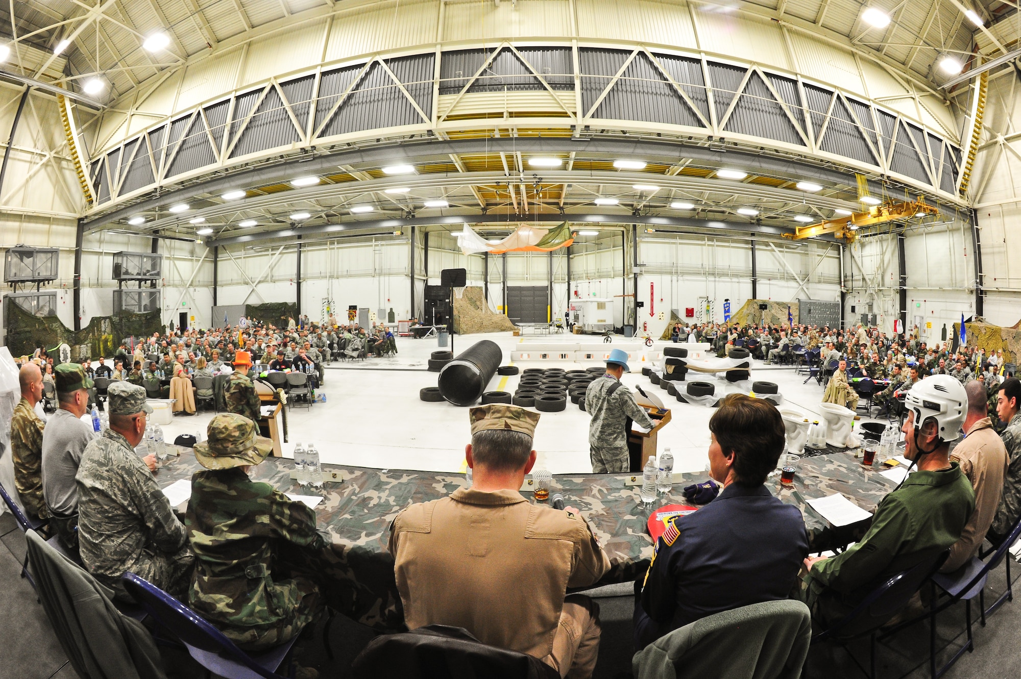 Air Force Reservists gather March 1, 2014, at the 310th Space Wing's Combat Dining In/Annual Awards Ceremony at Peterson Air Force Base, Colo. The wing sponsored the event to both recognize its annual award winners and bring together the Reservists to enjoy an evening of esprit de corps, unit morale and camaraderie. (U.S. Air Force photo/Tech. Sgt. Nicholas B. Ontiveros)