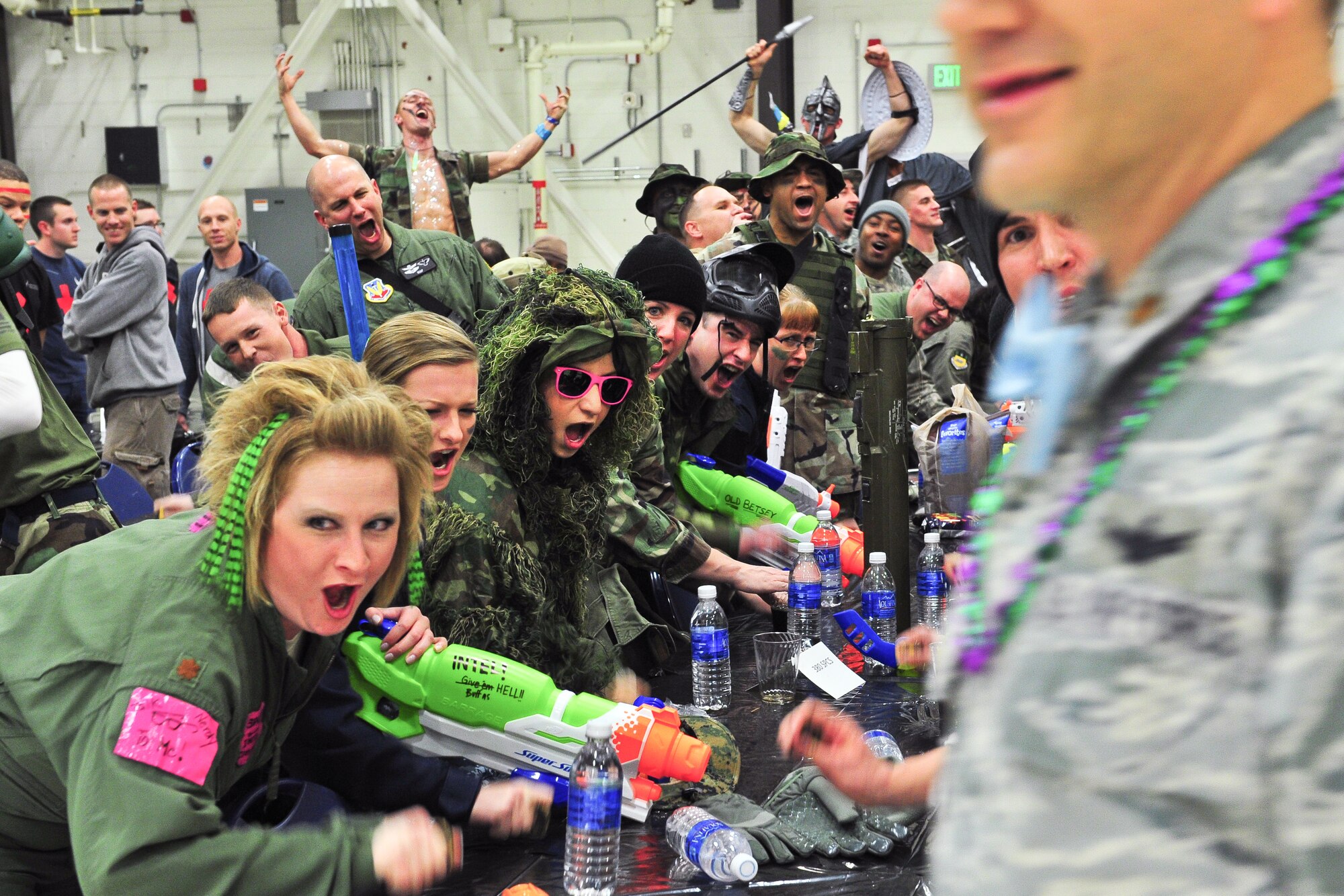 Air Force Reservists loudly express their presence March 1, 2014, during the 310th Space Wing's Combat Dining In/Annual Awards Ceremony at Peterson Air Force Base, Colo. The wing sponsored the event to both recognize its annual award winners and bring together the Reservists to enjoy an evening of esprit de corps, unit morale and camaraderie. (U.S. Air Force photo/Tech. Sgt. Nicholas B. Ontiveros)