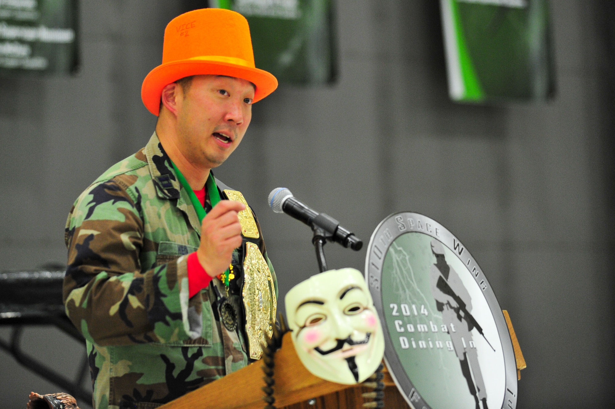 Air Force Reserve Maj. Andrew Heo, the evening’s master of ceremonies, keeps the event moving March 1, 2014, during the 310th Space Wing's Combat Dining In/Annual Awards Ceremony at Peterson Air Force Base, Colo. The wing sponsored the event to both recognize its annual award winners and bring together the Reservists to enjoy an evening of esprit de corps, unit morale and camaraderie. Heo is a member of the Reserve National Security Space Institute. (U.S. Air Force photo/Tech. Sgt. Nicholas B. Ontiveros)