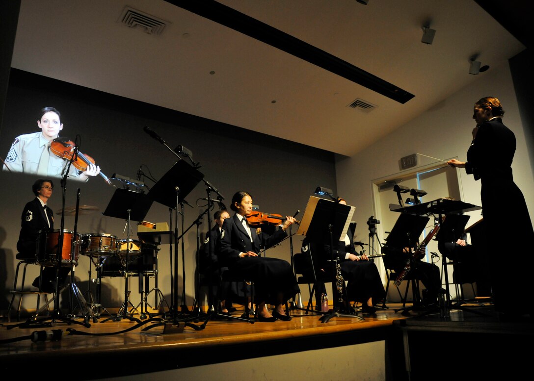 An all-female ensemble from The  U.S. Air Force Band performs Igor Stravinky's "The Soldier's Tale," complete with acting and singing, at the Women in Military Service for America Memorial in Arlington, Va. on March 2, 2014.  The group’s performance marked the first time the group performed together. (U.S. Air Force photo/Senior Airman Lindsey A. Porter)