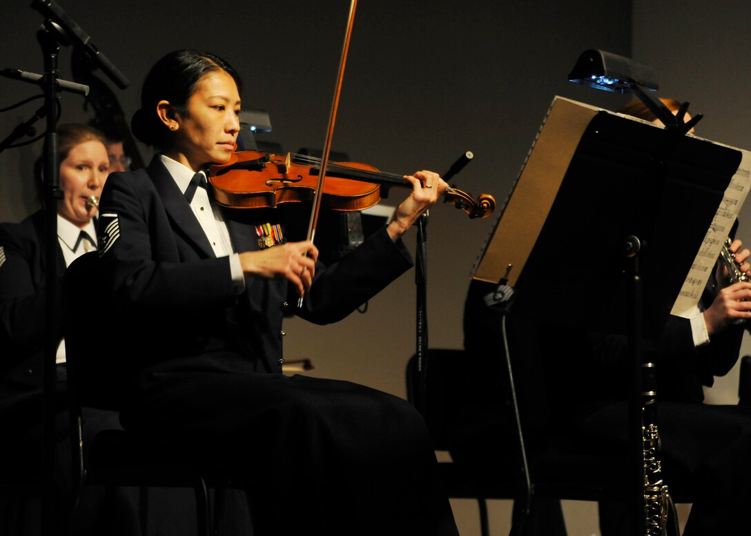 Master Sgt. Mari Washington, concertmaster for The U.S. Air Force Band Strings, performs with an all-female ensemble March 2, 2014 at the Women in Military Service for America Memorial in Arlington, Va. The group performed Igor Stravinky's "The Soldier's Tale"  marking the first time the all-female group performed together. (U.S. Air Force photo/Senior Airman Lindsey A. Porter)