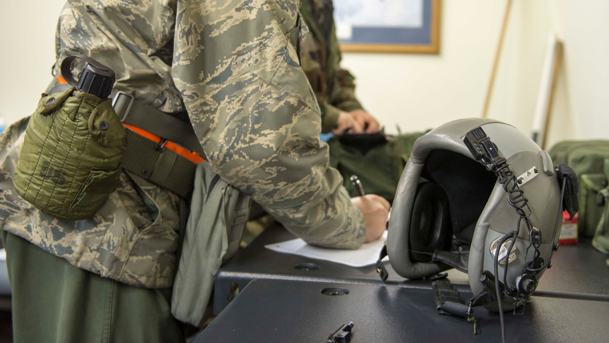 An Airman checks out protective gear during the Samurai Readiness Inspection at Yokota Air Base, Japan, March 5, 2014. The SRI allows the commanders to evaluate their units on their unique mission sets for effectiveness, compliance, readiness and discipline. (U.S. Air Force photo by Airman 1st Class David Danford / released)