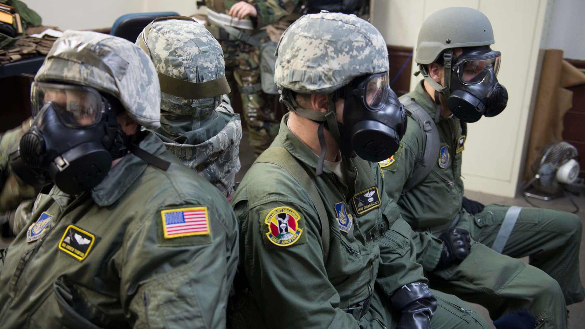Members of the 36th Airlift Squadron have to remain in shelter during the Samurai Readiness Inspection at Yokota Air Base, Japan, March 5, 2014.  Yokota Airmen performed a chemical warfare scenario as part of the inspection.  (U.S. Air Force photo by Airman 1st Class David Danford / released)