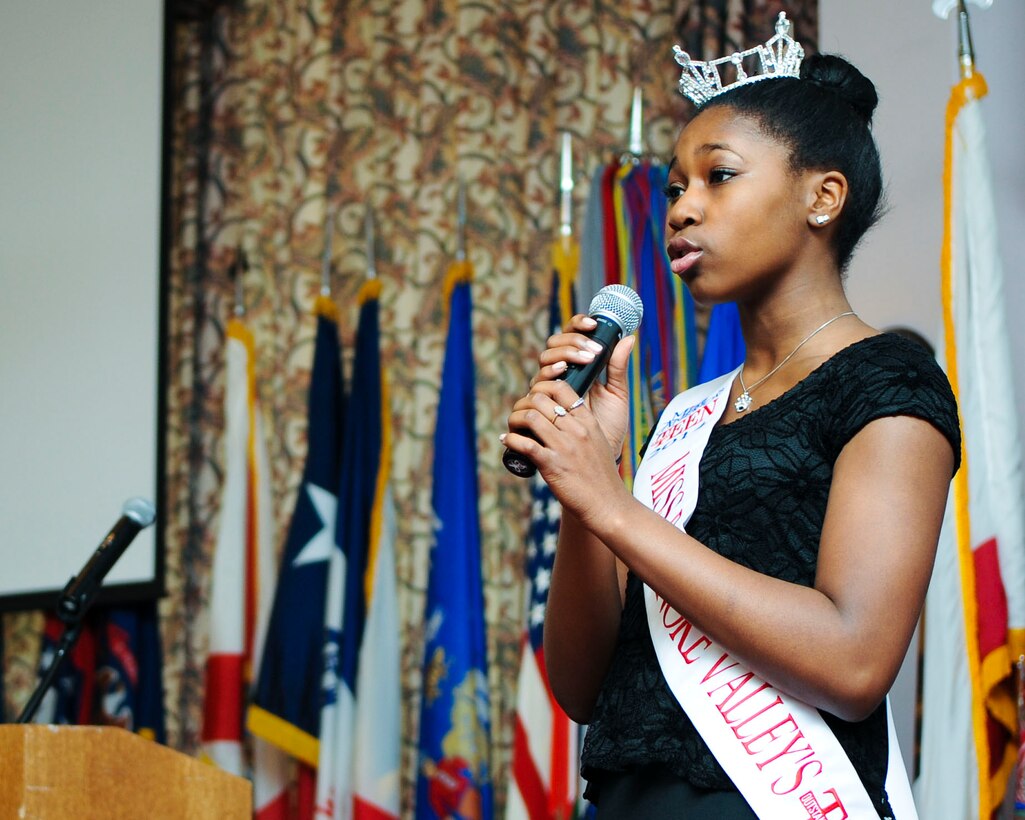 Taylor Burrell, 15, 2013 Miss Roanoke Valley Outstanding Teen, performs during an African-American History Month observance luncheon at Fort Eustis, Feb. 26, 2014. Taylor performed a traditional folk song. Taylor hails from Yorktown, Va. (U.S. Air Force photo by Senior Airman Austin Harvill/Released)