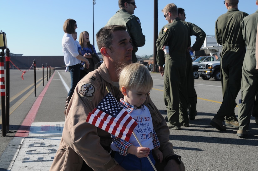 Capt. Matthew Van Osterom, 16th Airlift Squadron is reunited with his son Connor  after returning from a 60-day deployment. The 16th AS Airmen conducted combat operations in support of OEF while deployed with the 816th Expeditionary Airlift Squadron. (U.S. Air Force photo/Capt. Sean Perry)