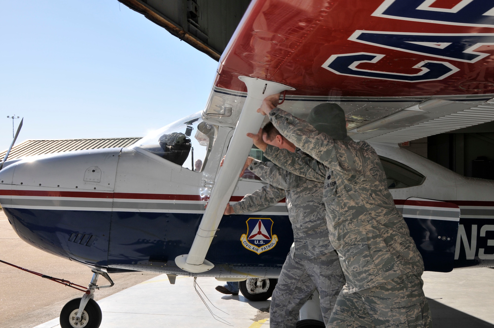 U.S. Air Force airmen with the 181st Intelligence Wing, Indiana Air National Guard prepare a Civil Air Patrol aircraft for take-off for the Operation Blue Sky Incident Analysis and Assessment mission over central Indiana Feb. 21, 2014. The 181st IW deployed an Aerial Collections Team to conduct aerial assessment of flooding in Tippecanoe and Fulton Counties in order to provide Indiana Department of Homeland Security with an accurate assessment of flooding.  The 181st Intelligence Wing is crucial to State domestic response. (U.S. Air National Guard photo by Senior Master Sgt. John S. Chapman/Released)