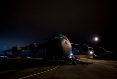 Staff Sgt. Ryan Tobkin and Staff Sgt. Ryan Jordan, 437th Aircraft Maintenance Squadron electronic warfare systems technicians, replace the infrared countermeasure housing on a C-17 Globemaster III March 3, 2014, at Joint Base Charleston – Air Base, S.C. The infrared countermeasure is used to stop homing missiles or devices from striking the aircraft. (U.S. Air Force photo/ Senior Airman Dennis Sloan)
